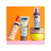 Set de productos IDC Institute con crema corporal, loción sérum, limpiador y hidratante para una rutina completa de cuidado de la piel