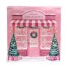 Calendario de Adviento AQC 12 Days of Fragrances con diseño navideño rosa y 12 compartimentos de perfumes.